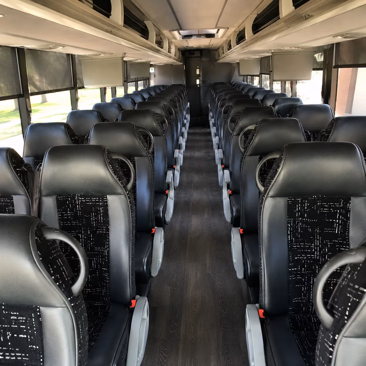 how one way transfers round trips and multi day bookings are priced for grand rapids bus rentals